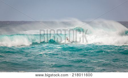 SUNSET BEACH HAWAII USA - DECEMBER 2, 2017: Surfer competing at the 2017 Vans World Cup of Surfing competition at Sunset Beach on Oahu's scenic North Shore. This is the second of three surfing competitions and Conner Coffin took first place.