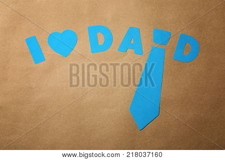 Composition with phrase I LOVE DAD for Father's Day on craft paper