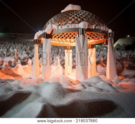 Mystical graveyard memorial in winter snow night