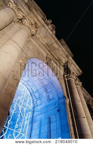 Madrid, Spain - December 8, 2017: Puerta de Alcala in Madrid at night on Christmas time. Low angle view