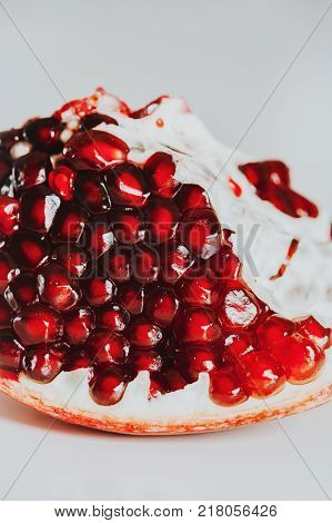 Close up image of pomegrenate on white background