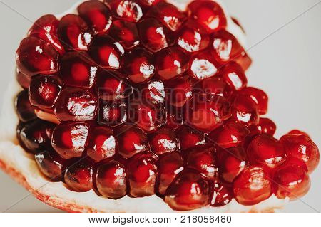 Close up image of pomegrenate on white background
