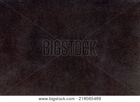 black leather background textured with graining patterns