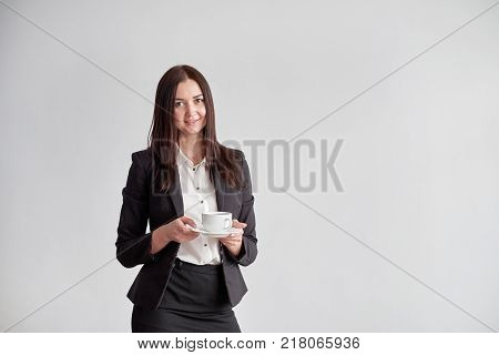 office worker offering you a cup of coffee or tea over white background.