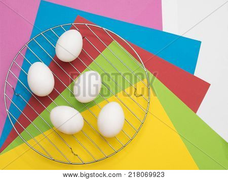 Easter Eggs on colorful background. The concept of a holiday and a happy Easter. Top view. Copy space. Easter mock up.