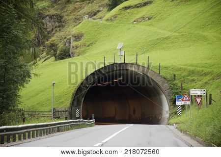 Italian people and foreigner travelers driving car on the road passed mountain in Car tunnel go to Christmas Market in Meran city on September 2 2017 in Merano Italy