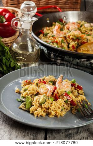 Traditional Seafood Paella With Shrimp, Fish And Chicken Seved I