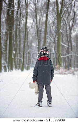 Sad Lost Child, Boy In A Forest With Teddy Bear, Wintertime