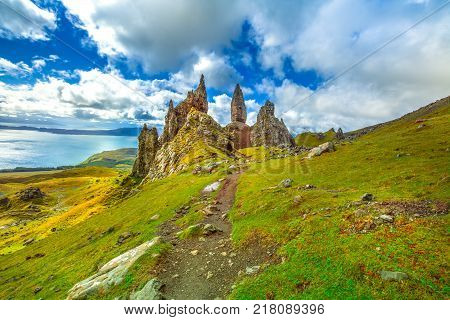 Old Man of Storr, large pinnacle of rock on top of a north hill in the isle of Skye, Highlands in Scotland, United Kingdom. The Old Man of Storr is one of the most photographed wonders in the world.