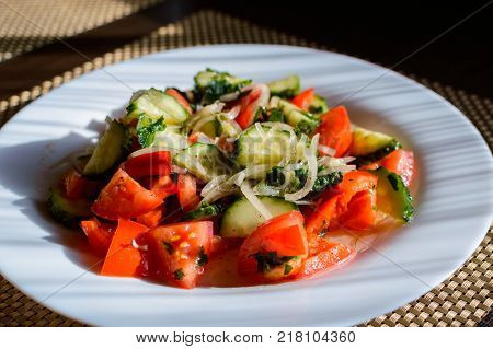 Vegetable salad. Plate of salad with vegetables. Assortment of ingredients of vegetable salad.