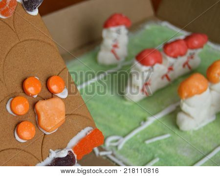 angled tiger paw on gingerbread home with marshmallow football players