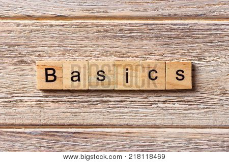 BASICS word written on wood block. BASICS text on table concept.