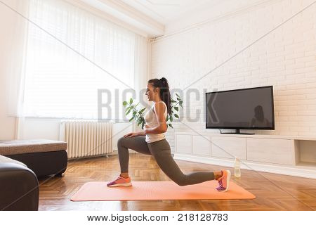 Fit Young Woman Exsercise In The Room