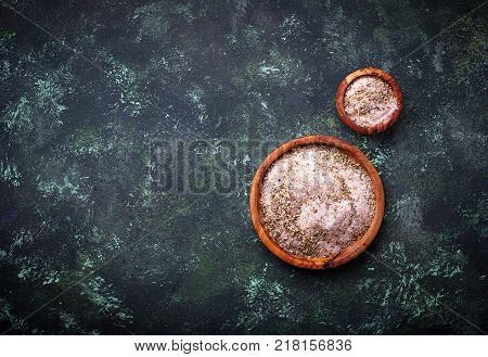 Himalayan salt with dried herbs. Aromatic spices. Selective f ocus