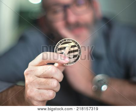 Litecoin Cryptocurrency In Hand Of A Casual Businessman