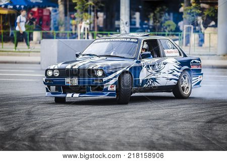 23 september 2017 drift bmv 3 a crowd of unidentified people watching with interest the maneuvers of an experienced driverChisinauMoldova