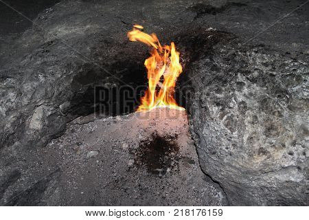 Natural gas burning directly from the ground with the Mediterranean Sea behind Chimera at Yanartas Cirali Turkey.