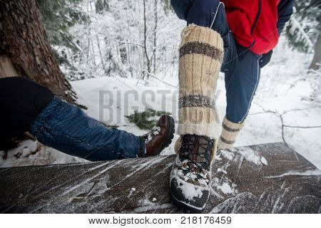 Trekking adventure into mountain during winter snow and break for drinking tea