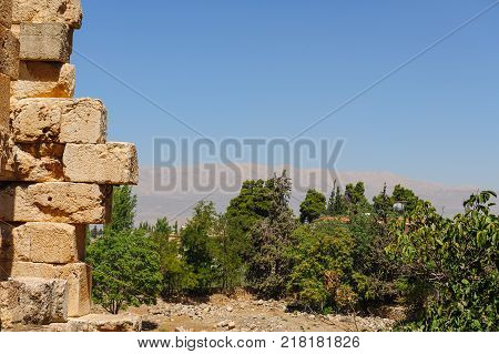 Baalbek Ancient city in Lebanon.Heliopolis temple complex.Mountains in front of Syria.remains