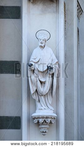 ROME, ITALY - SEPTEMBER 02: Statue of St. Patrick on the facade of Sacro Cuore del Suffragio church in Rome, Italy  on September 02, 2016.