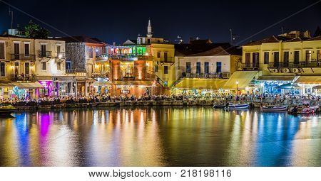 RETHYMNO CRETE - SEPTEMBER 20: Terrace of restaurant full of people in port of city on September 20 2017 in Rethymno