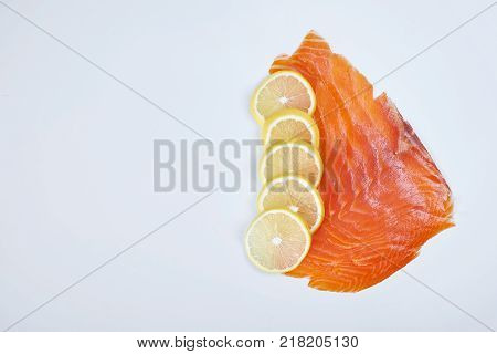 Smoked Fillet trout with lemon, isolated. Seafood