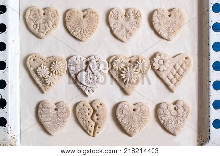 Making souvenirs from salty dough for Valentine's Day with your own hands. Art project handmade. DIY. Step-by-step photo instructions. Step 3. Drying hearts from salted dough