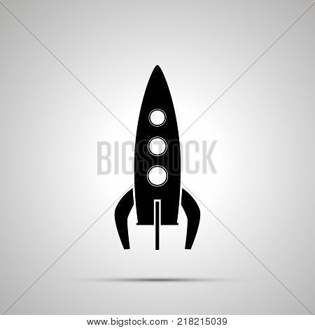 Spaceship silhouette, simple black icon with shadow