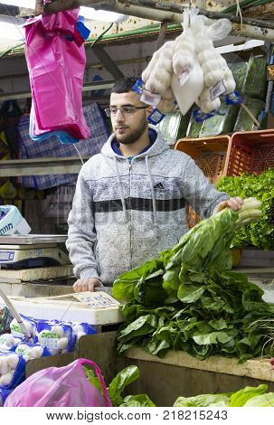 TEL AVIV , ISRAEL - 21 NOVEMBER 2017: Sellers on the old grocery street Nahalat-Benjamin