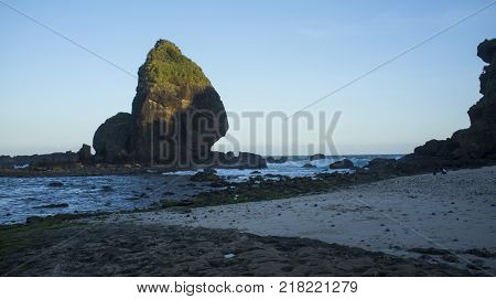 INDONESIA: Scenery of Tanjung Papuma Beach with rock and mossy foreground. Papuma beach is located at Jember,Surabaya, East Java.