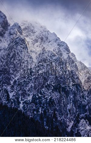 Beautiful winter landscape with Carpati Piatra Craiului mountains in Romania