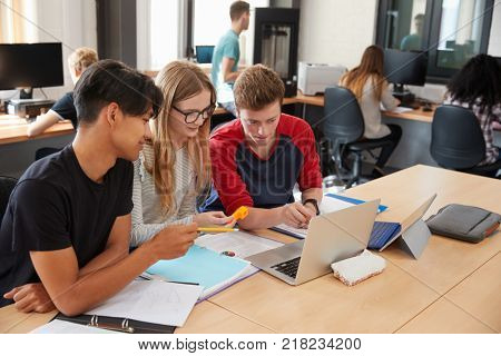 Design Students Working In CAD/3D Printing Lab Together