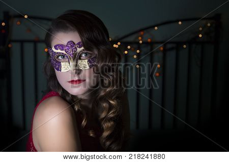 Beautiful Woman Holdind A Carnival Mask. Halloween Holiday Concept.