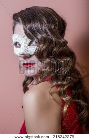 Beautiful Woman Holdind A Carnival Mask. Halloween Holiday Concept.