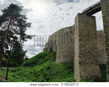 Wooden bridge held by massive rock pillars leads the way into the Neamt Citadel, is a medieval fortress located in north-eastern part of Romania near Targu Neamt, Neamt County.