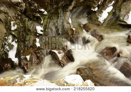 The river Bruar cuts its way over smooth rocks to the waterfall