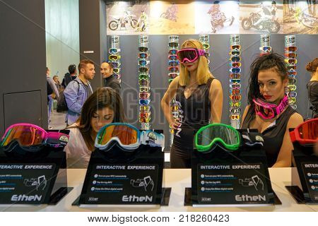 MILAN, ITALY - NOVEMBER 11, 2017: women wear Ethen products EICMA 2017 - 75th International Motorcycle Exhibition