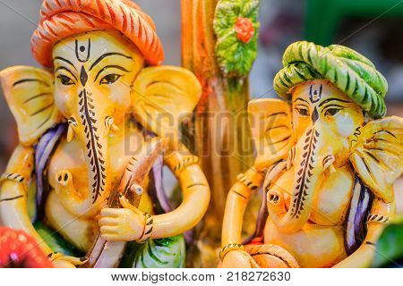 Colorful dolls made of clay Lord Ganesha handicrafts on display during the Handicraft Fair in Kolkata earlier Calcutta West Bengal India. It is the biggest handicrafts fair in Asia.