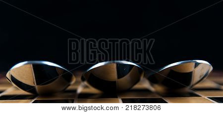 Chess spoons	isolated on black background, abstract image.