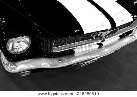 Sankt-Petersburg Russia July 21 2017: Front view of Classic retro Ford Mustang GT.Car exterior details. Headlight of a retro car. Black and white. Photo Taken on Royal Auto Show July 21