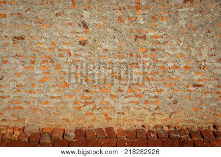 A typical mud brick wall of a house in Uganda.