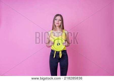 bright beautiful girl model with a sweet button on a bright holiday background