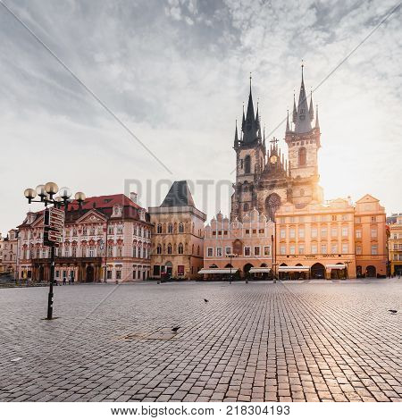 PRAGUE, CZECH REPUBLIC - JUNE 05, 2016: Kostel Panny Marie pred Tynem at the sunrise. Church of the Virgin Mary. Beautiful Old Town Square with the church without people in Romanesque - Gothic style.