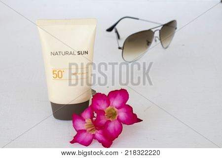 natural sun cosmetics for skin face suncreen spf50 and accessories of woman on white