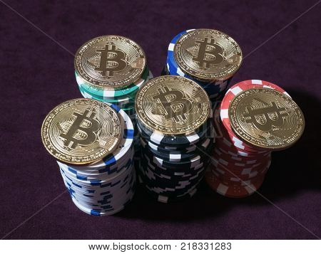 Bitcoin coins on poker chips. New virtual and real currency. The concept of replacement bitcoin in all forms of payment.
