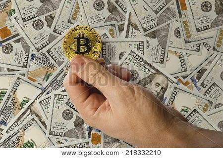 A Man Holds In His Hand A Coin Of A Cryptomoney Bit Coin Bitcoin