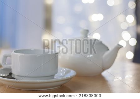 the image white Cup on table in cafe