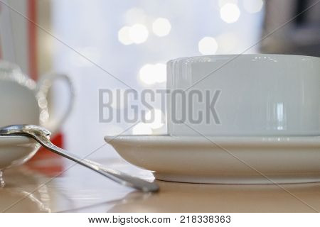 the image white Cup on table in cafe