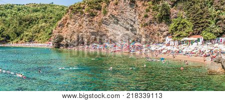 Budva, Montenegro - August 18, 2017: Fragment of Mogren beach in Budva, Montenegro is one of the most popular beaches on the Budva Riviera.