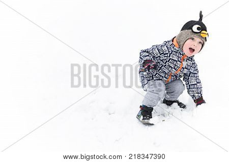 A Boy Plays in the Snow. Copy Space